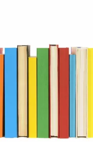 Row of colorful books isolated on a white background